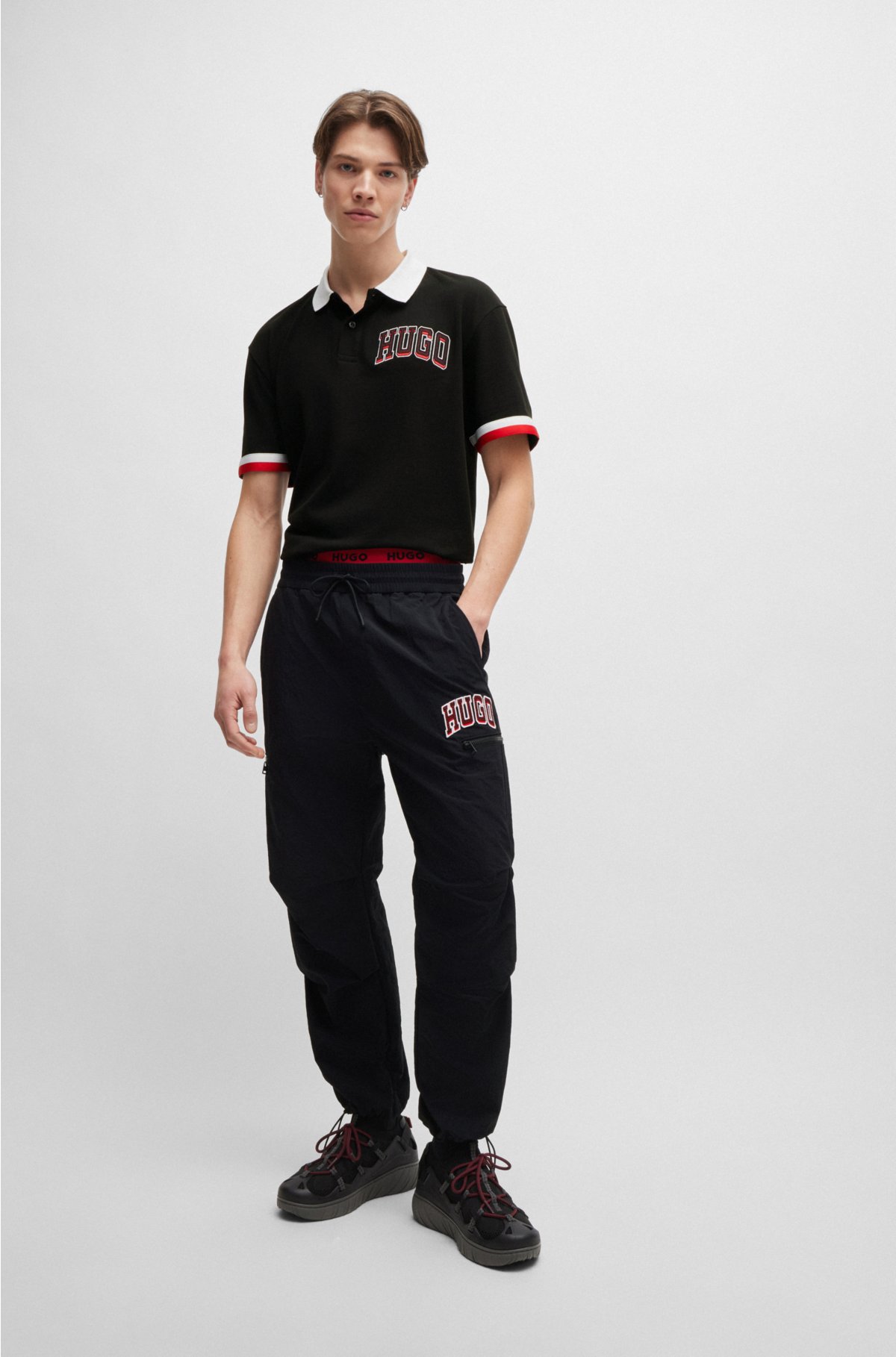 Cotton-piqué polo shirt with varsity-style logo badge, Black