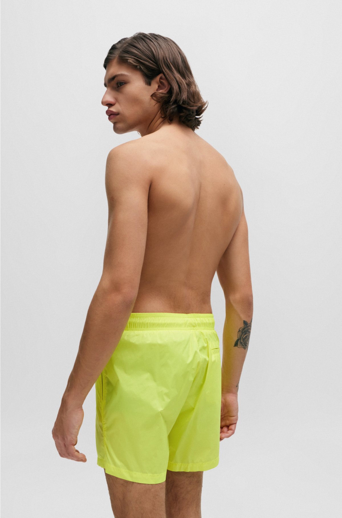 Quick-dry swim shorts with stacked-logo print, Yellow