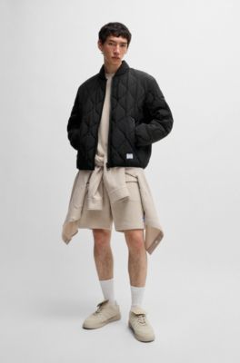 Water-repellent quilted jacket with logo badge, Black