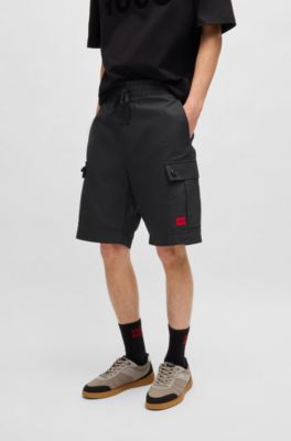 Shorts aus strukturierter Baumwolle mit rotem Logo-Label, Schwarz