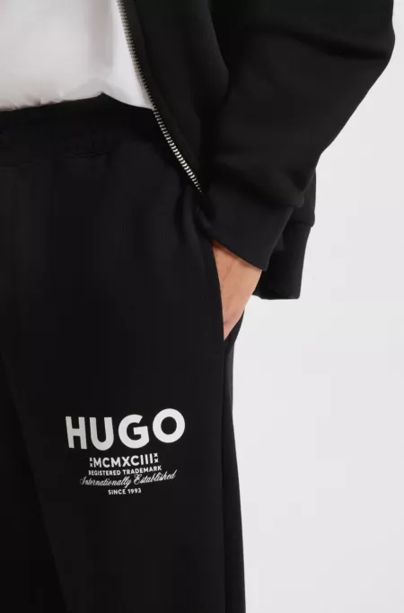 Cotton-terry tracksuit bottoms with logo print