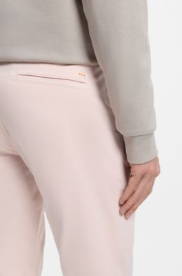 Slim-fit trousers in overdyed stretch satin, light pink