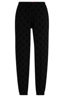 HUGO BOSS TRACKSUIT BOTTOMS IN STRETCH FABRIC WITH STACKED LOGOS