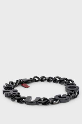 Chain cuff with inserted logo letters, Black