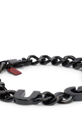 Chain cuff with inserted logo letters, Black