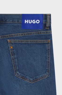 Jeans slim fit de denim el&aacute;stico en azul medio, Azul