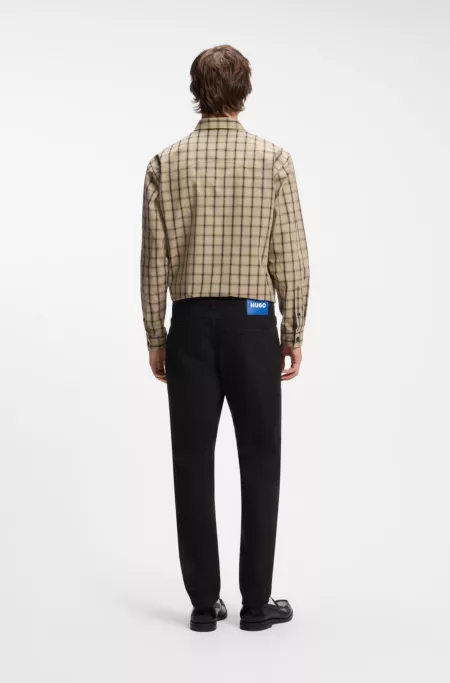 Tapered-fit jeans in black stretch denim