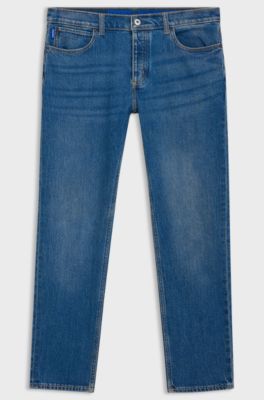 Jeans con fit affusolato in denim elasticizzato blu, Blu