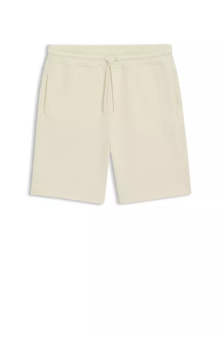 Relaxed-fit shorts in cotton terry with logo badge