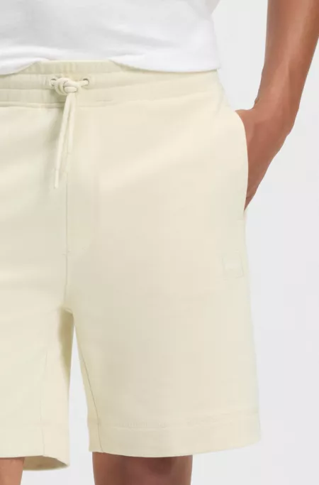Relaxed-fit shorts in cotton terry with logo badge