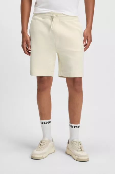 Relaxed-fit shorts in cotton terry with logo badge