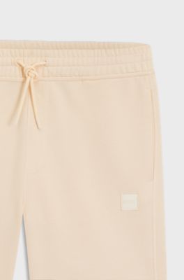 Bermuda in terry di cotone con patch con logo, Arancio chiaro