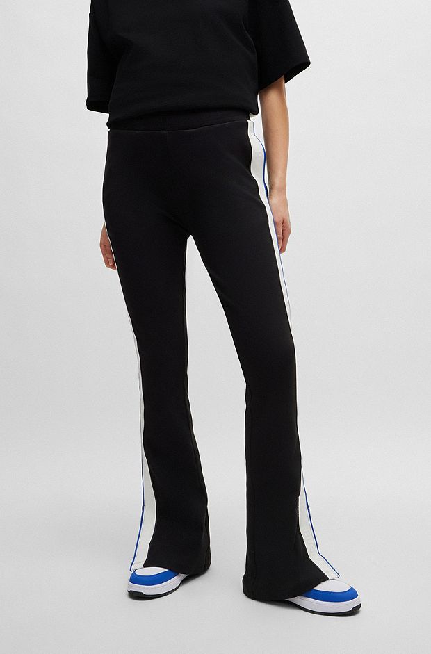 Flared tracksuit bottoms in stretch cotton with logo tape, Black