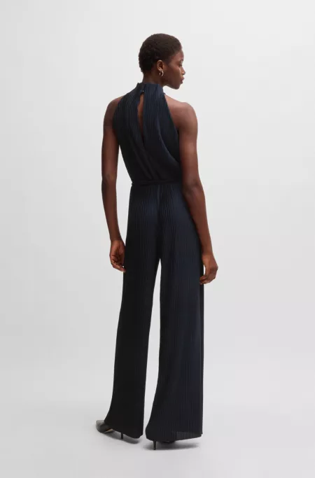 Sleeveless jumpsuit with plissé pleats and tie belt