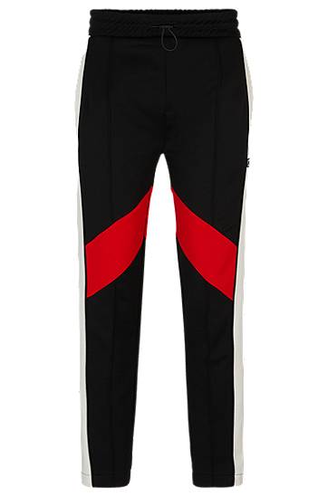 Relaxed-fit tracksuit bottoms with colour-blocking, Hugo boss
