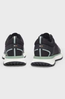 Mixed-material trainers with mesh details and branding, Black