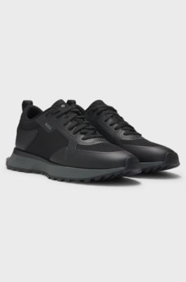 Mixed-material trainers with mesh details and branding, Black