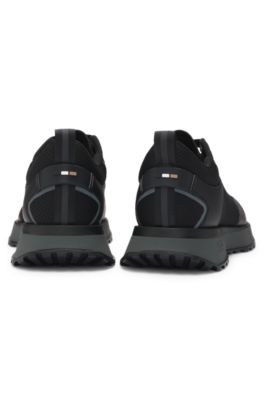 Mixed-material trainers with mesh details and branding, Black