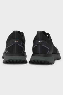 Mixed-material trainers with mesh details and branding, Black