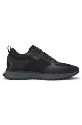 Mixed-material trainers with mesh details and branding, Black