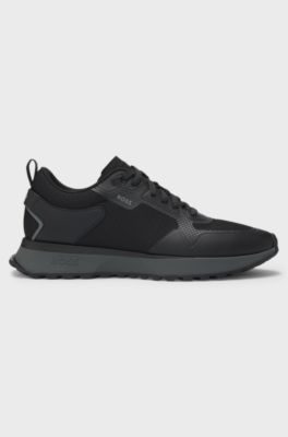 Mixed-material trainers with mesh details and branding, Black