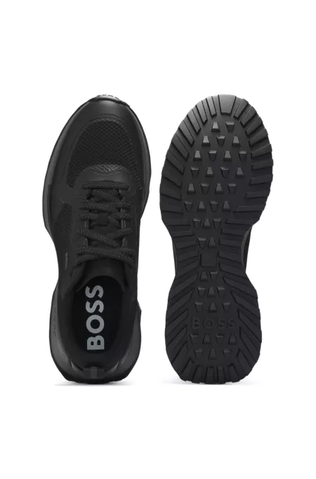 Mixed-material trainers with mesh details and branding