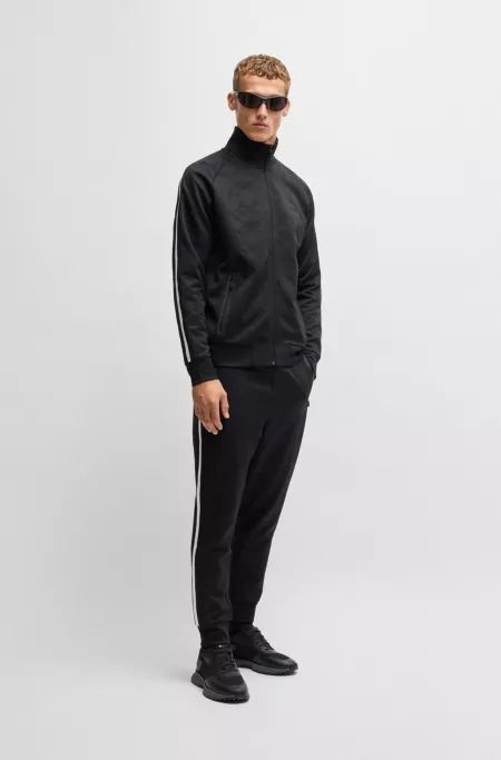 Mixed-material trainers with mesh details and branding