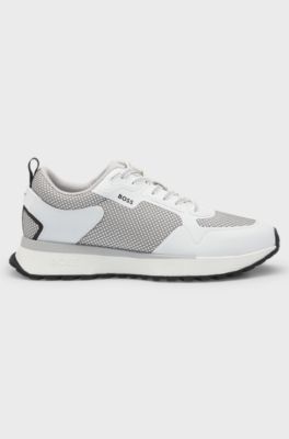 Mixed-material trainers with mesh details and branding, White