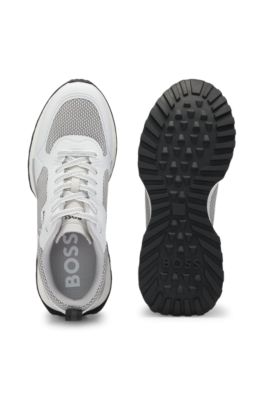 Mixed-material trainers with mesh details and branding, White