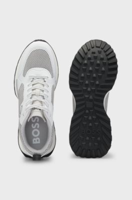 Mixed-material trainers with mesh details and branding, White