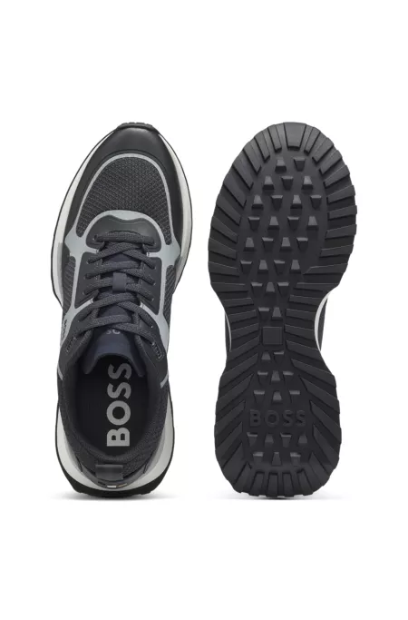 Mixed-material trainers with mesh details and branding