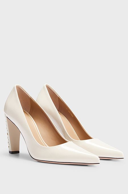 Leather pumps with monogram-patterned heels, White