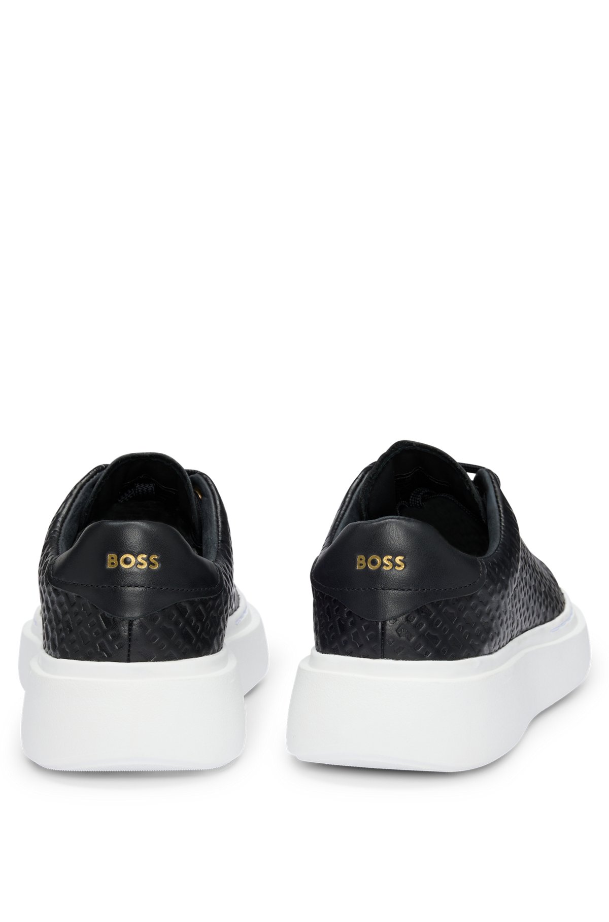 Cupsole trainers in leather with embossed monograms, Black