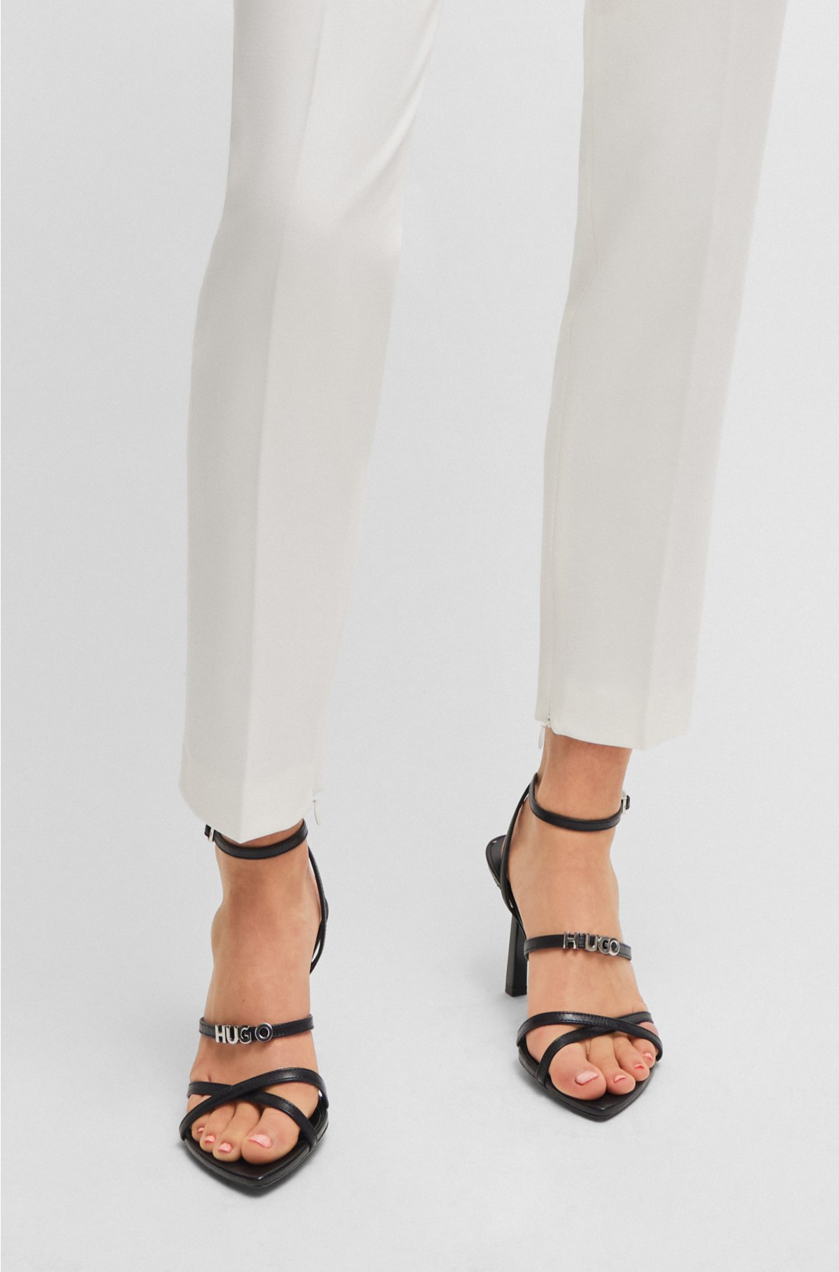 Slim-fit trousers with zip hems, White
