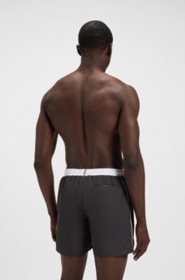 Badshorts med kontrastlogga och kantband, M&ouml;rkgr&aring;