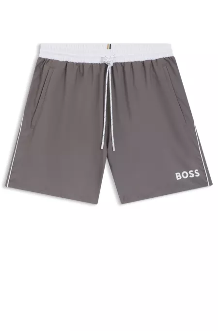 Bañador tipo shorts con logo y ribetes en contraste