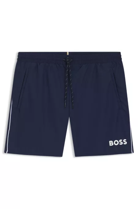 Bañador tipo shorts con logo y ribetes en contraste
