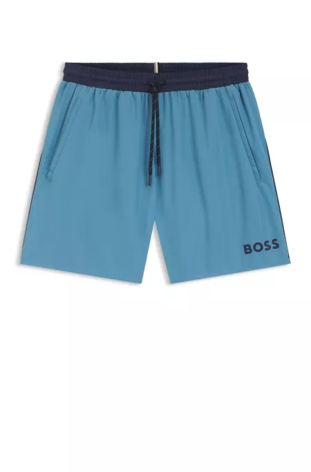 Bañador tipo shorts con logo y ribetes en contraste