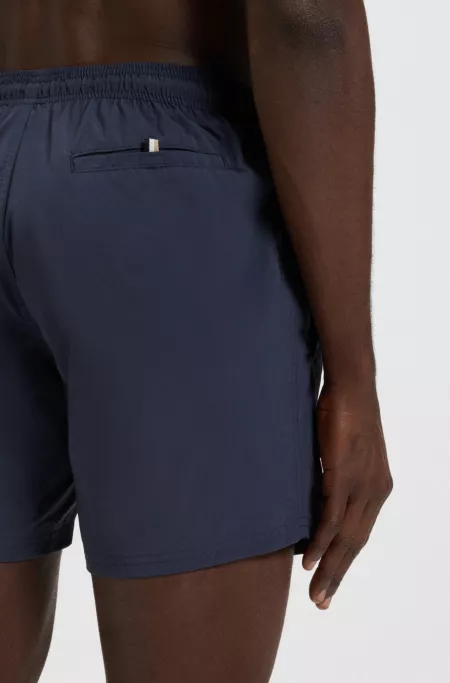 Swim shorts with vertical logo print