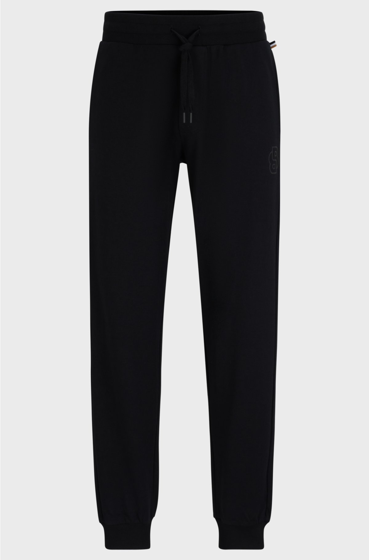 Cuffed tracksuit bottoms in cotton terry with double monogram, Black