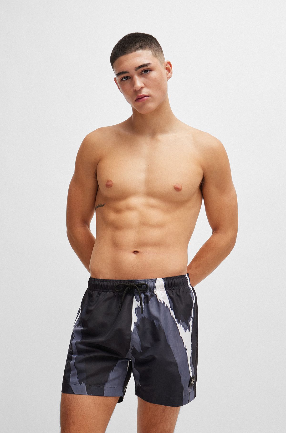 Seasonal-print quick-dry swim shorts with metallic logo, Black