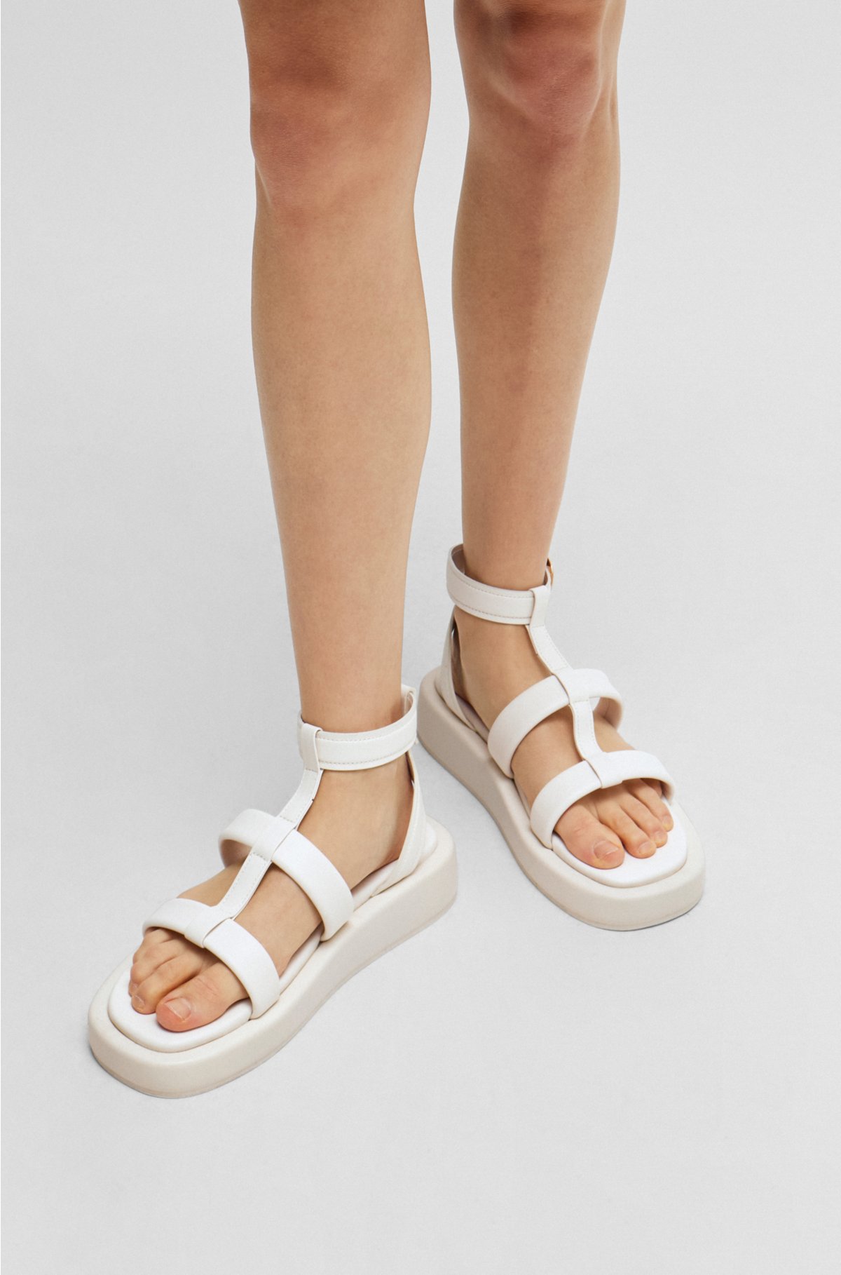 Platform leather sandals with branded buckle closure, White