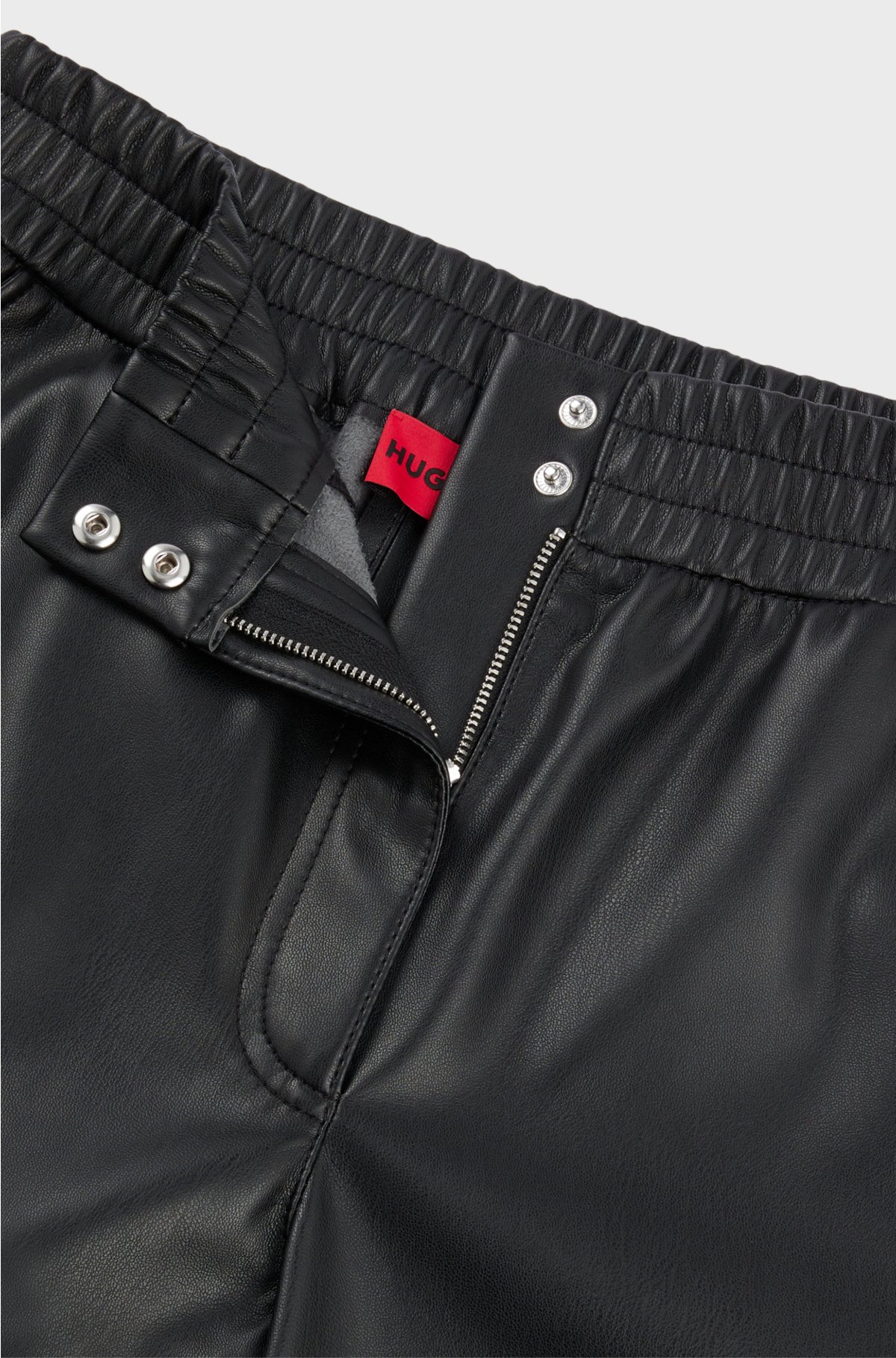 Relaxed-fit trousers in faux leather, Black