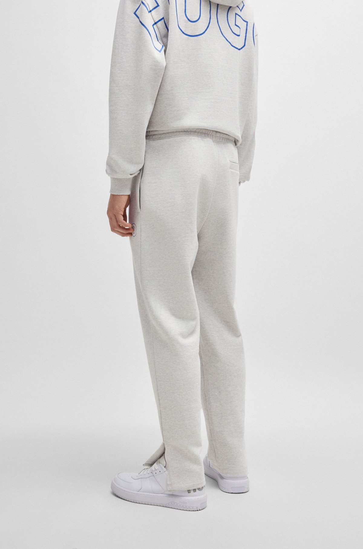HUGO - Loose-fit cotton-terry tracksuit bottoms with outline logo