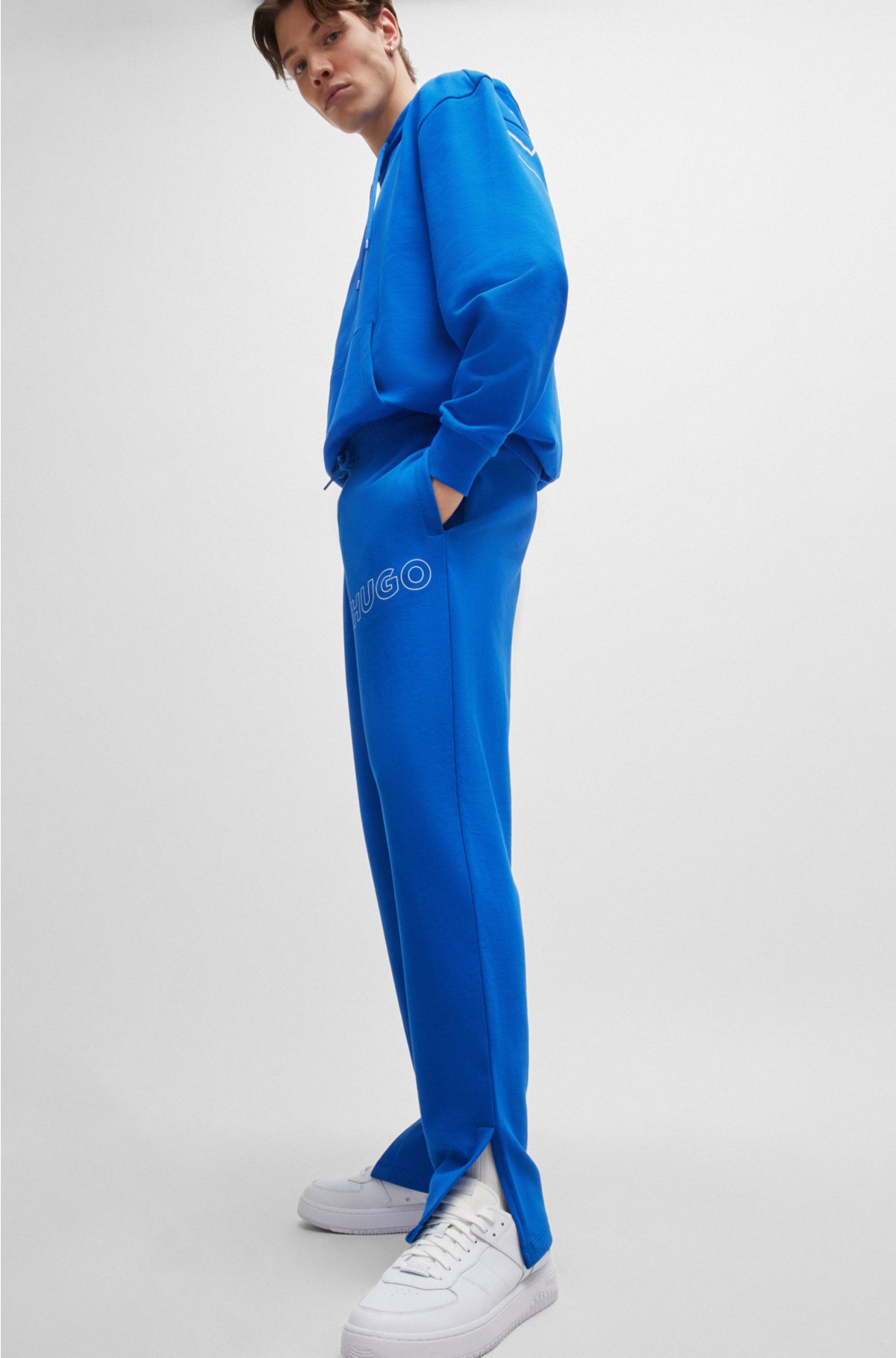 Loose-fit cotton-terry tracksuit bottoms with outline logo, Blue