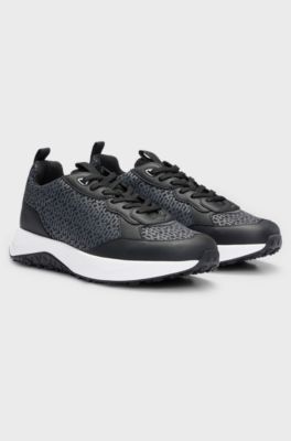 Mixed-material trainers with repeat-logo details, Black