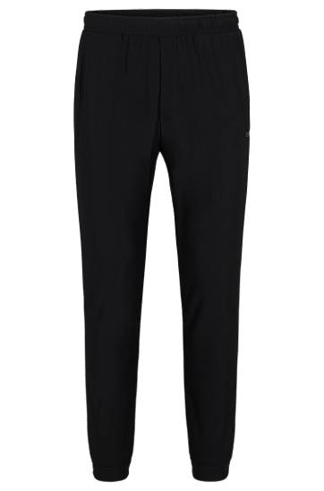 Tracksuit bottoms in stretch fabric with decorative reflective logo, Hugo boss