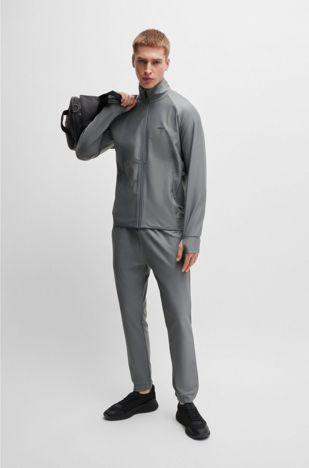Tracksuit bottoms in stretch fabric with decorative reflective logo, Dark Grey