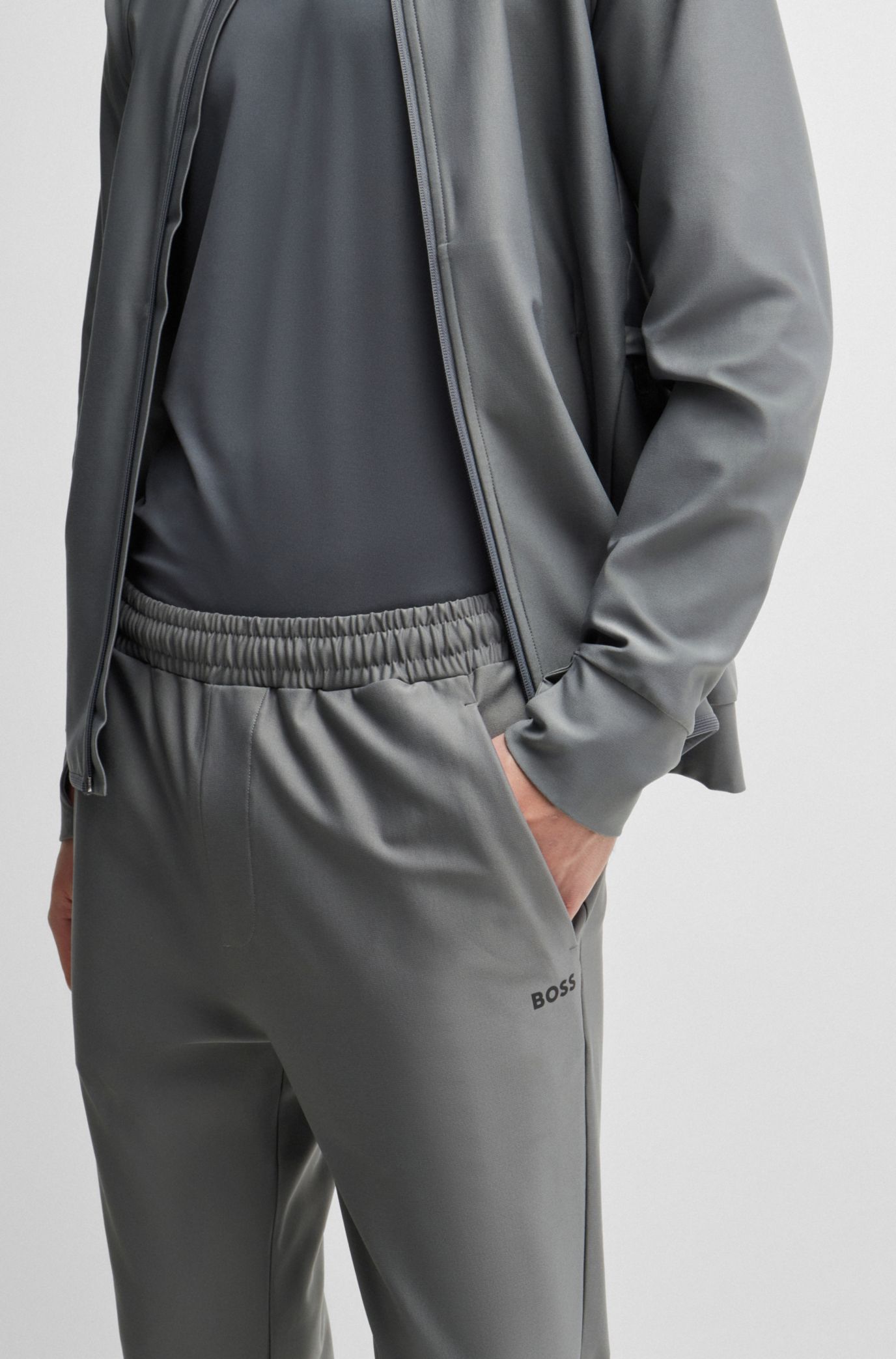 Tracksuit bottoms in stretch fabric with decorative reflective logo