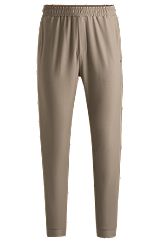 Tracksuit bottoms in stretch fabric with decorative reflective logo, Light Brown